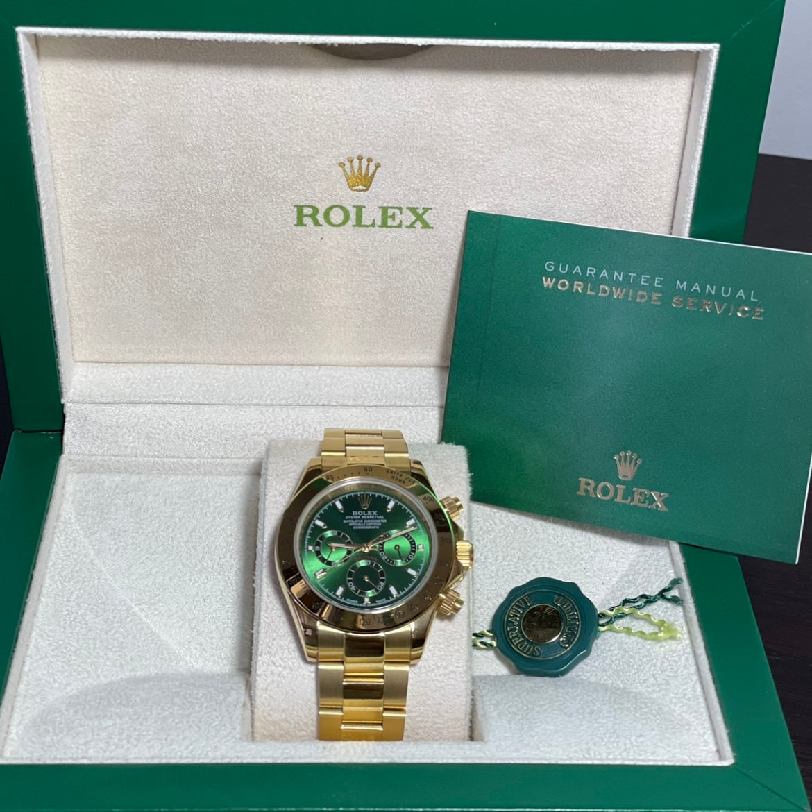 Orologio Rolex Daytona Green Gold 40 mm cinturino acciaio inox oro, presentato in scatola rolex.